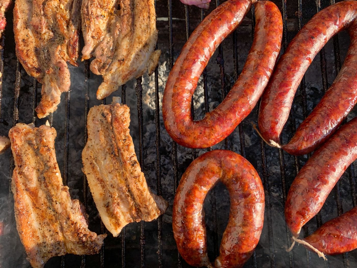 Grilled Pork Belly Slabs with Smoked Sausage Rings
