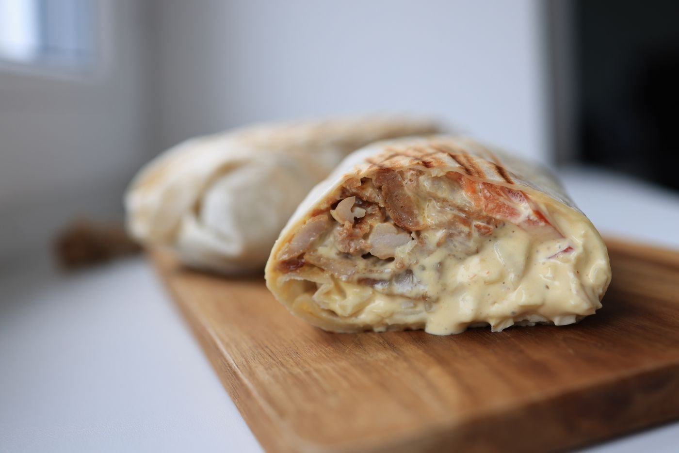 Queso-Smothered Chicken Burrito