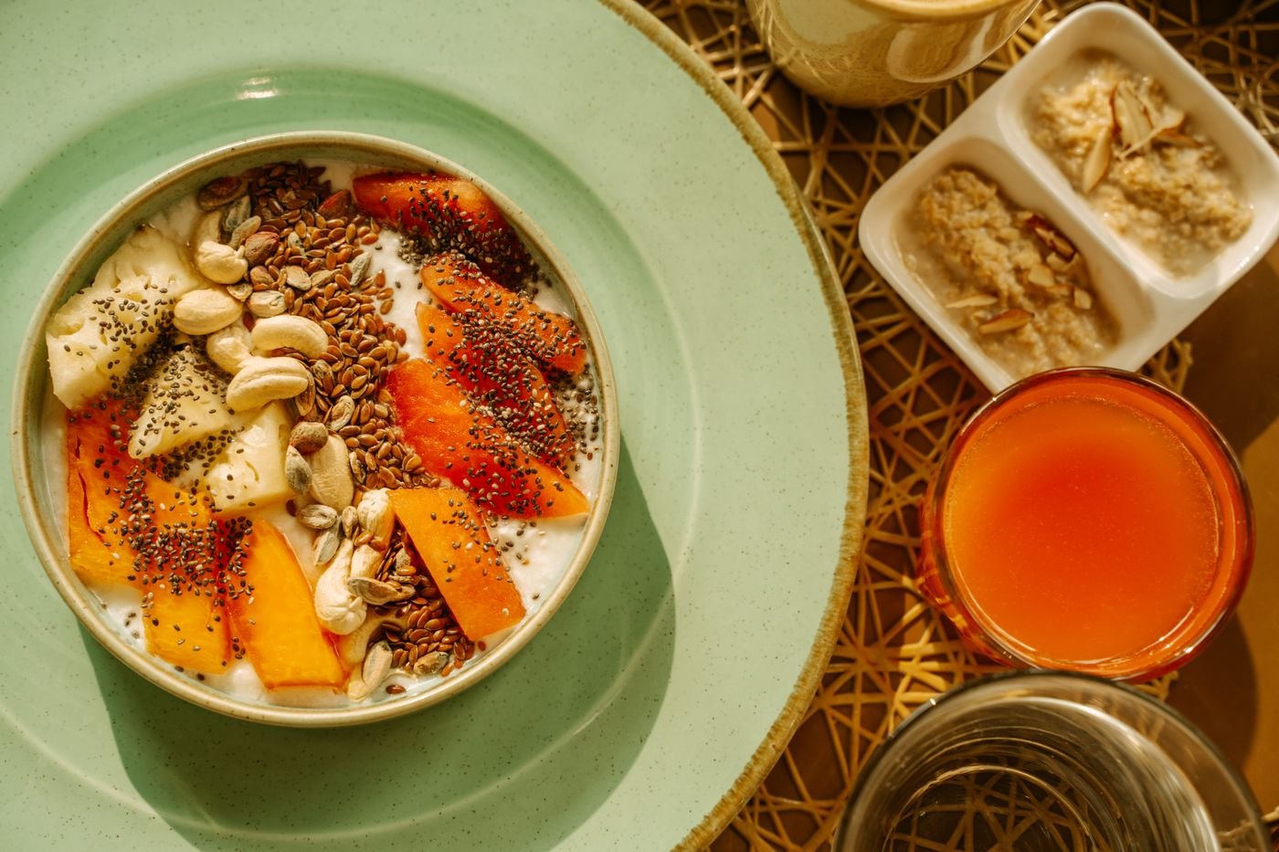 Papaya and Banana Yogurt Bowl with Cashews and Flaxseed