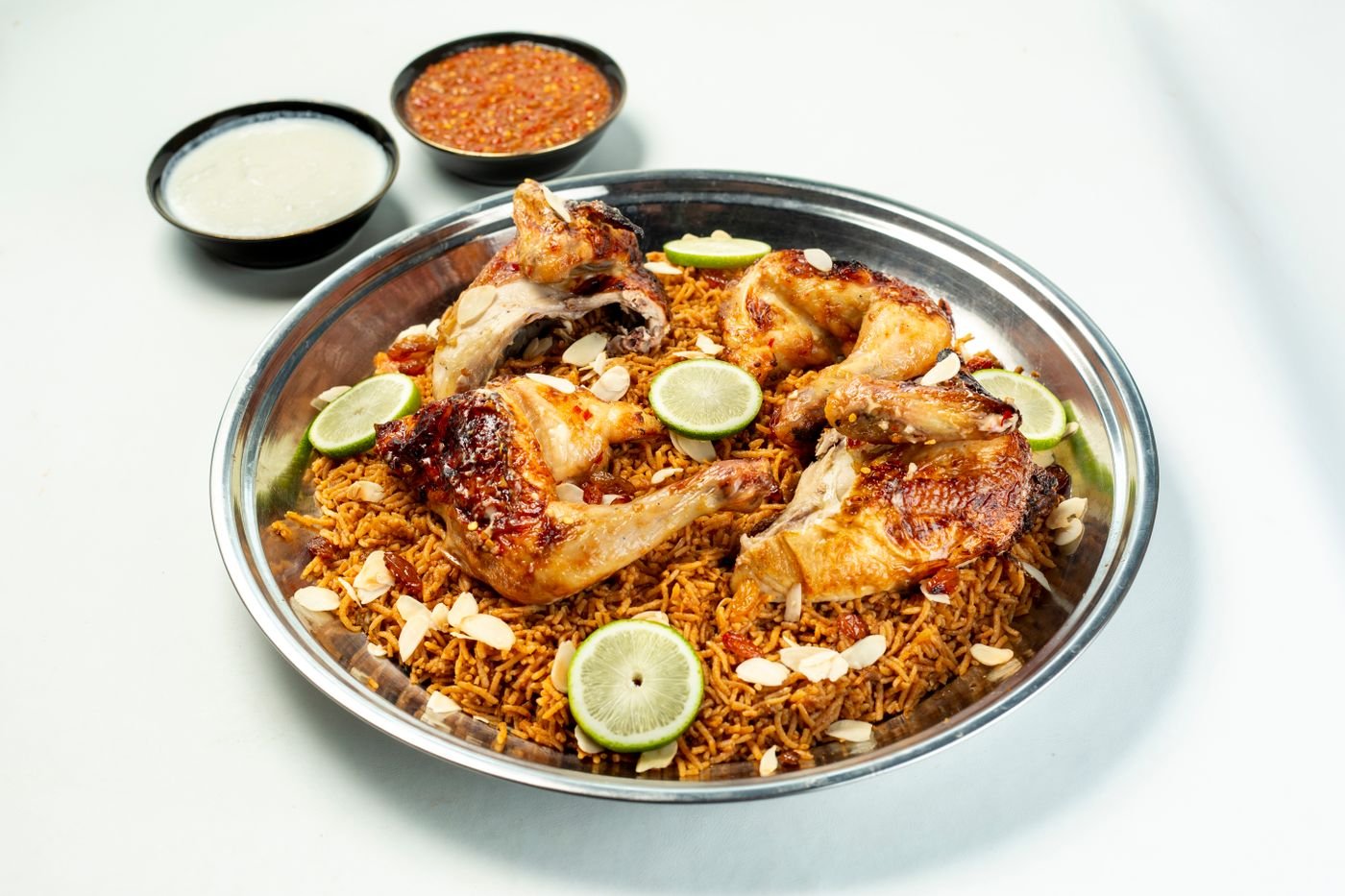 Yemeni Chicken Mandi with Almonds and Tomato Daqoos