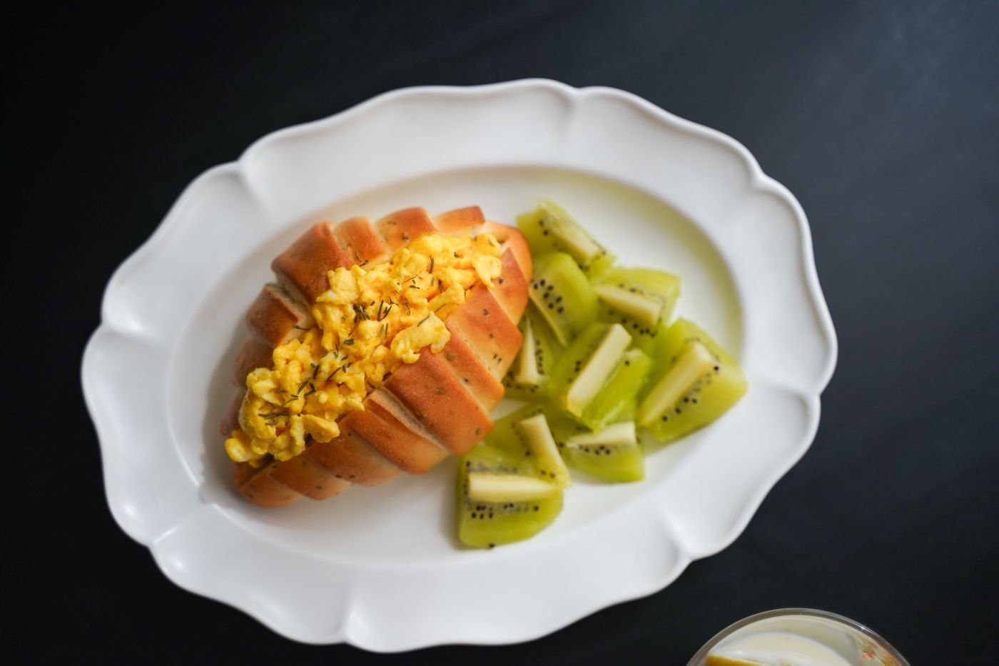 Brioche Roll Stuffed with Soft Scrambled Eggs and Kiwi