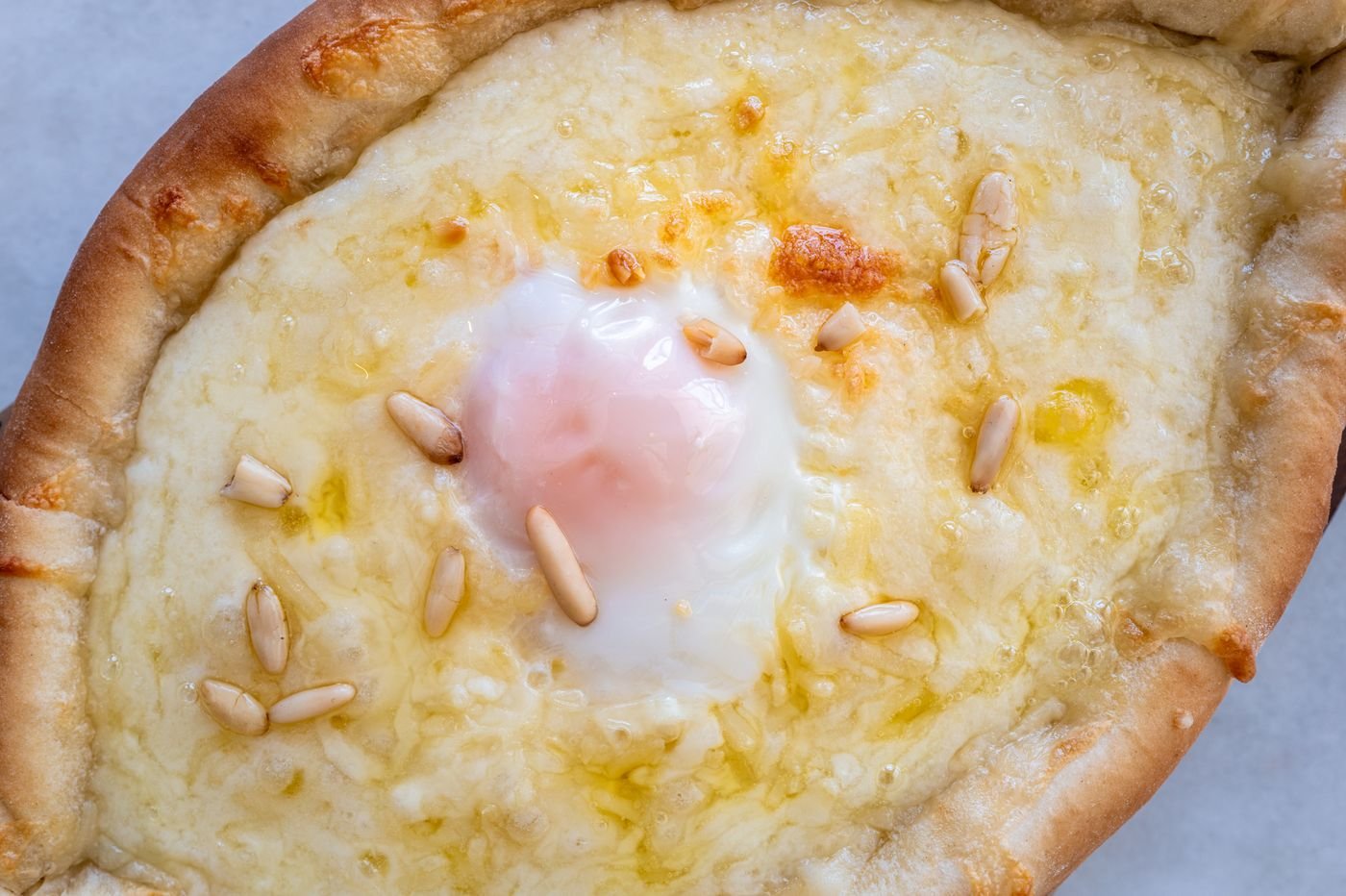 Cheese Boat Bread with Soft Egg and Pine Nuts