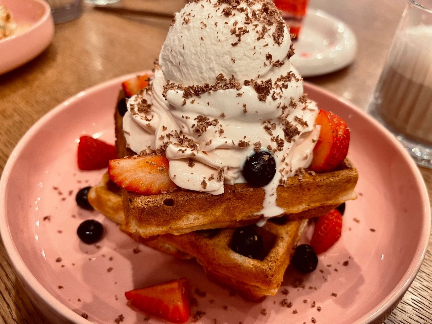 Strawberry Shortcake Waffles with Whipped Cream and Chocolate Shavings
