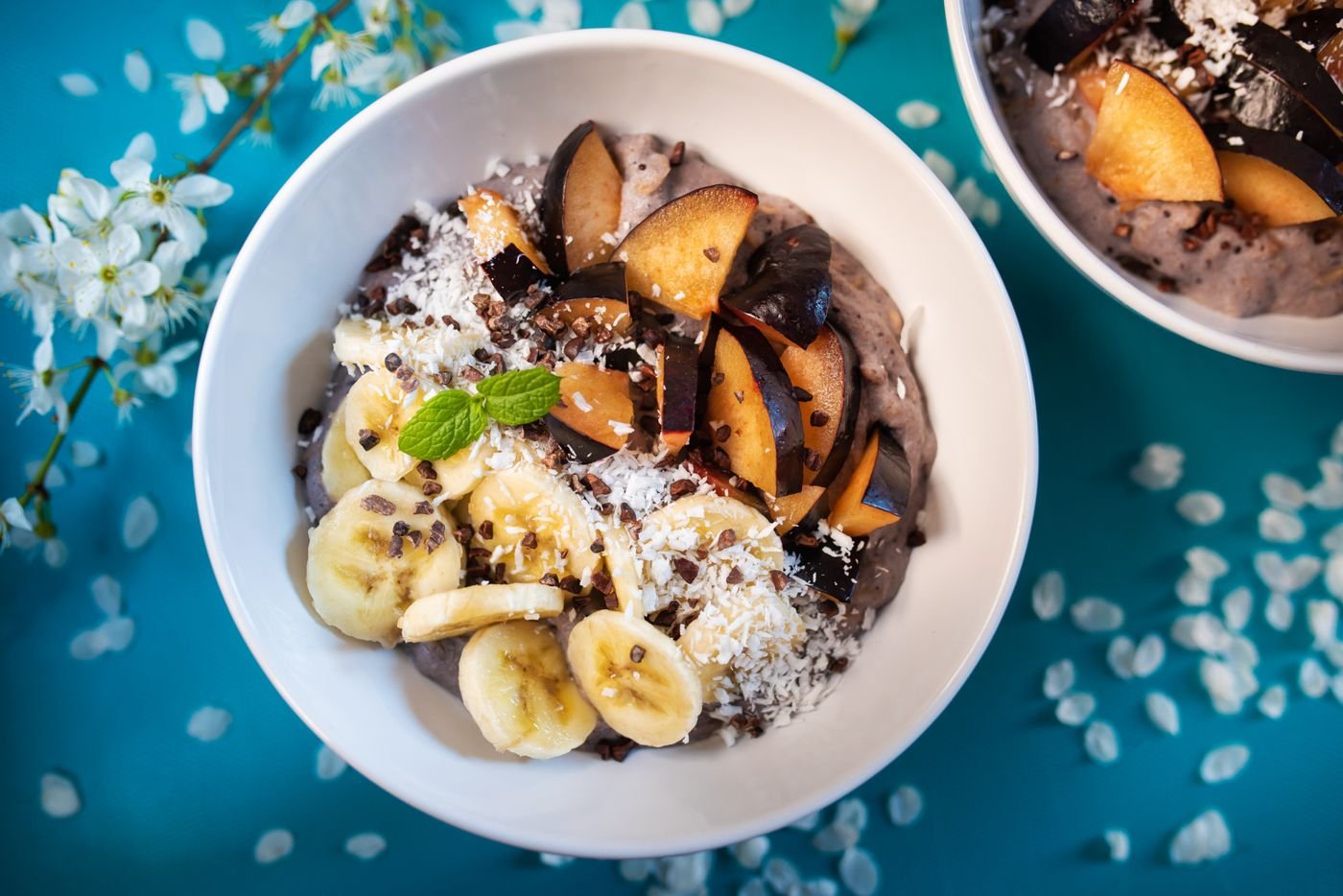 Chocolate Oat Porridge with Plums, Banana and Coconut
