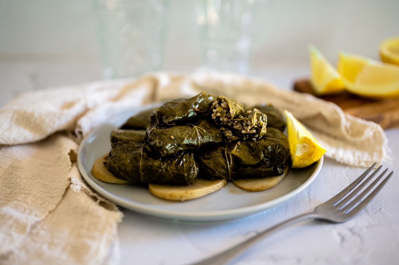 Lemony Dolmas Steamed over Potato Slices